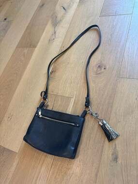 PRÜNE Black Bovine Leather Crossbody Bag with Tassel Charms